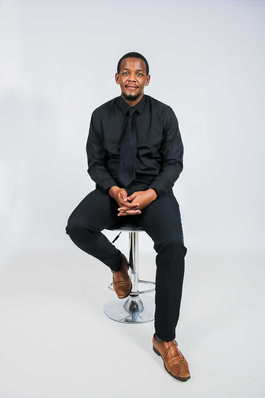 Fanelesibonge sitting on a chair looking professional